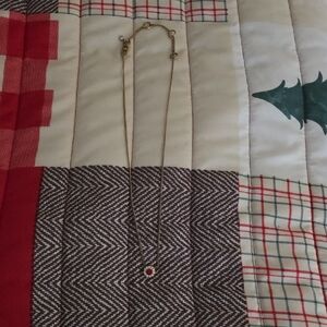 Elegant Gold Necklace with Red Pendant